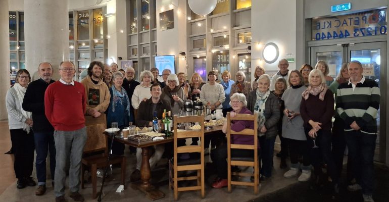 Volunteers and staff pose for a pic with Adam at his leaving do.